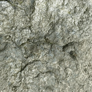 a stone wall with a black mark on it