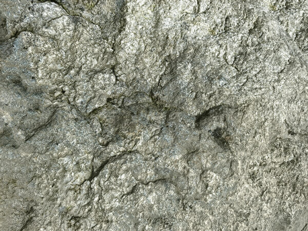 a stone wall with a black mark on it