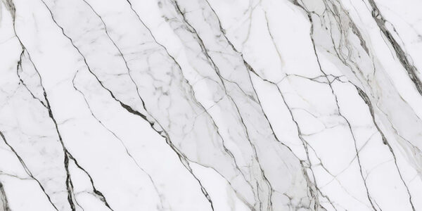 White marble surface featuring elegant gray veins and intricate patterns, showcasing a polished finish and a luxurious appearance.