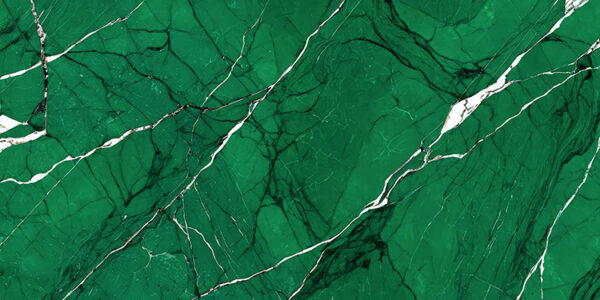 abstract background with a green and white marble texture. The marble has a glossy finish and appears to be polished to a shiny surface. The color of the marble is a deep, vibrant green with hints of white and gold. The texture is rough and uneven, with some areas appearing darker and others lighter. There are also a few thin, white lines that run diagonally across the image, creating a sense of depth and dimension. The overall effect is one of luxury and sophistication.