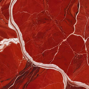 The image is an abstract background with a red and white marble texture. The marble has a deep red color with white veins running through it, creating a wave-like pattern. The veins appear to be jagged and uneven, with some areas appearing darker and others lighter. The texture of the marble is rough and uneven. The overall effect is one of depth and dimension.